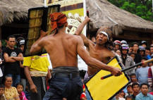 the mens with stick fighting